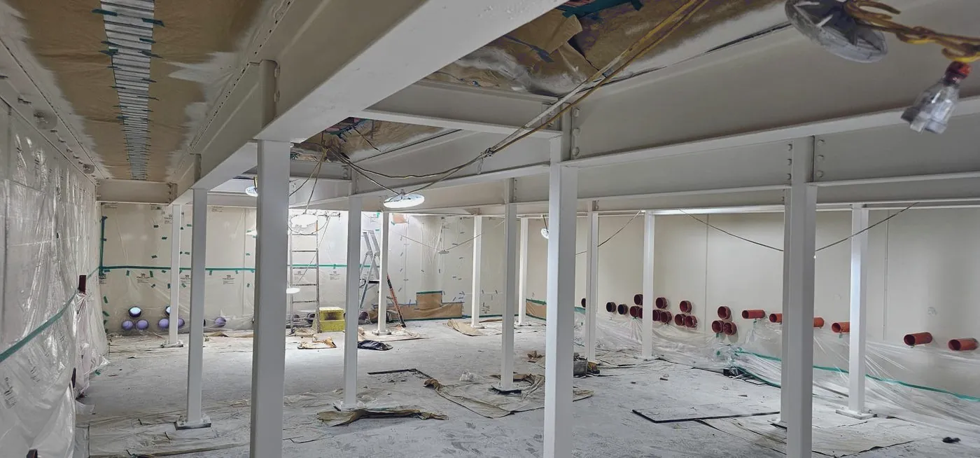 Completed white intumescent coating on an internal structural steel frame